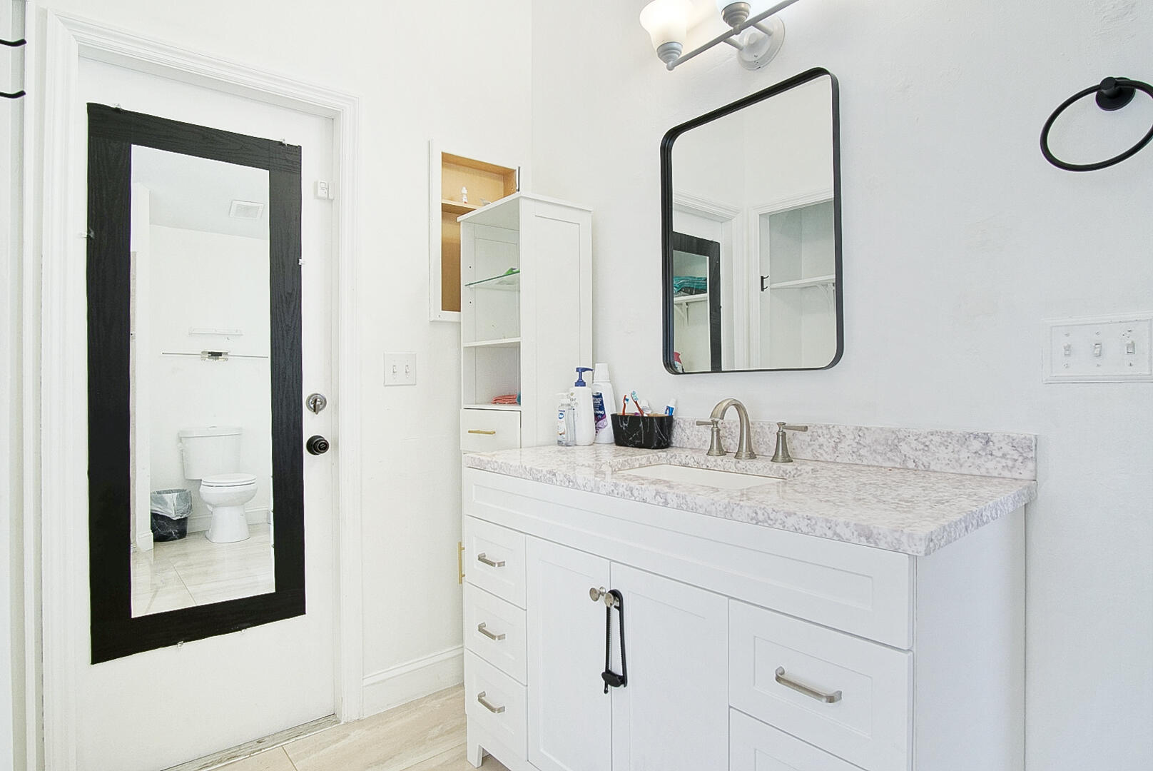 2619 Southwest Fair Isle Road Port St. Lucie, FL 34987 - Photo 15 of 33 a bathroom with a sink and a mirror