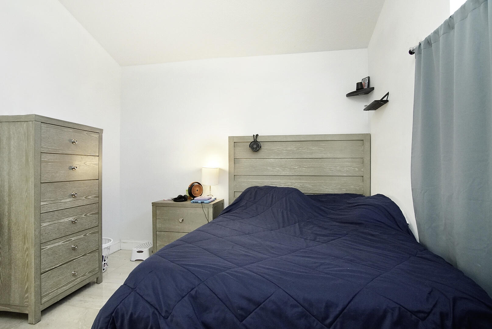 2619 Southwest Fair Isle Road Port St. Lucie, FL 34987 - Photo 19 of 33 a bedroom with a bed and cabinets