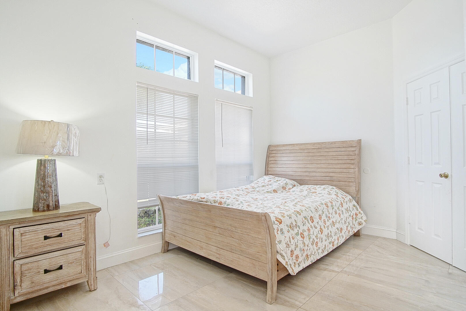 2619 Southwest Fair Isle Road Port St. Lucie, FL 34987 - Photo 20 of 33 a bedroom with a bed and a window