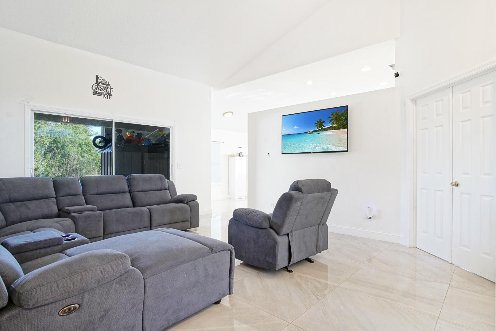 2619 Southwest Fair Isle Road Port St. Lucie, FL 34987 - Photo 23 of 33 a living room with furniture and a window