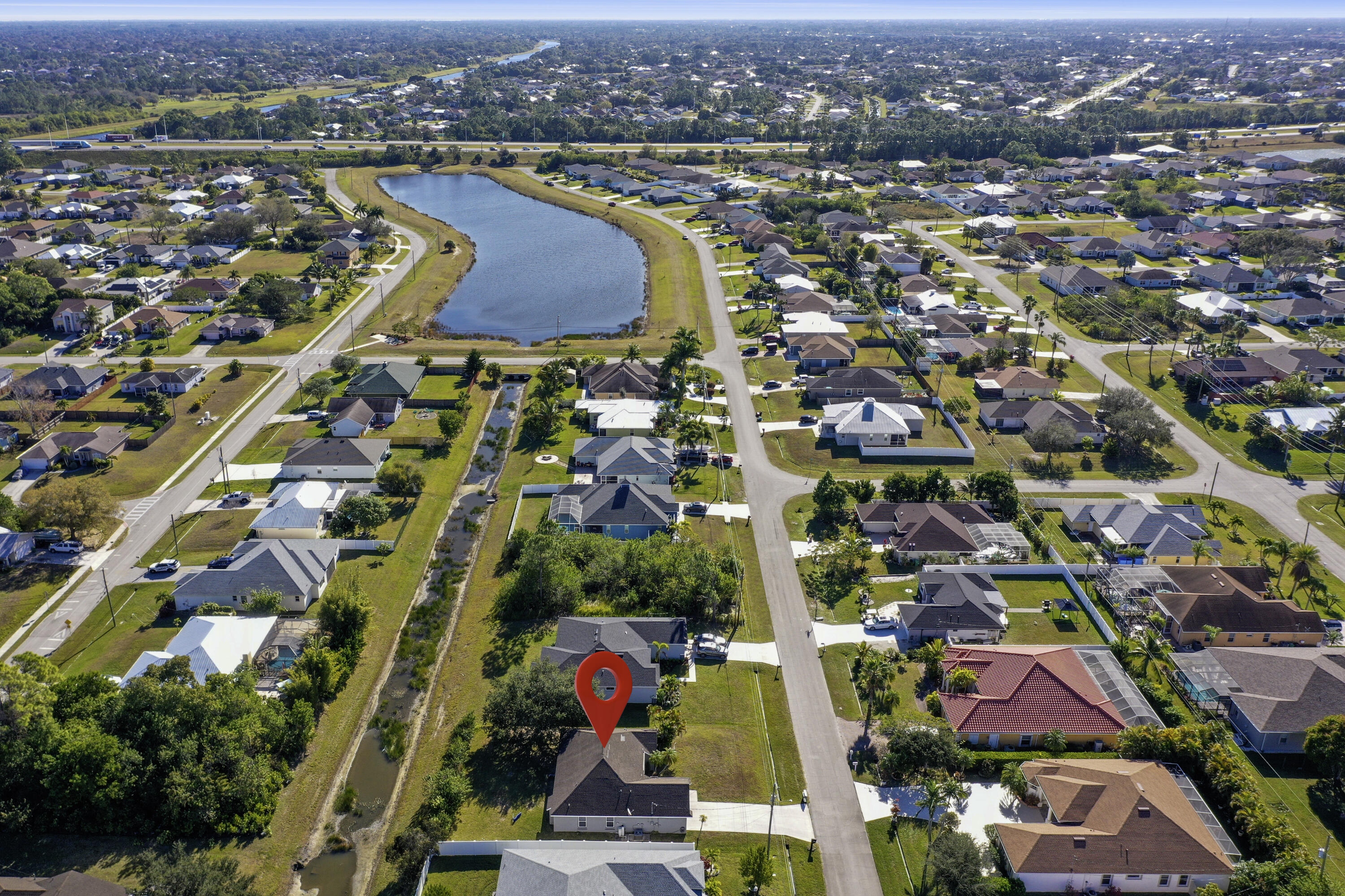 2619 Southwest Fair Isle Road Port St. Lucie, FL 34987 - Photo 24 of 33 an aerial view of residential houses with outdoor space and swimming pool