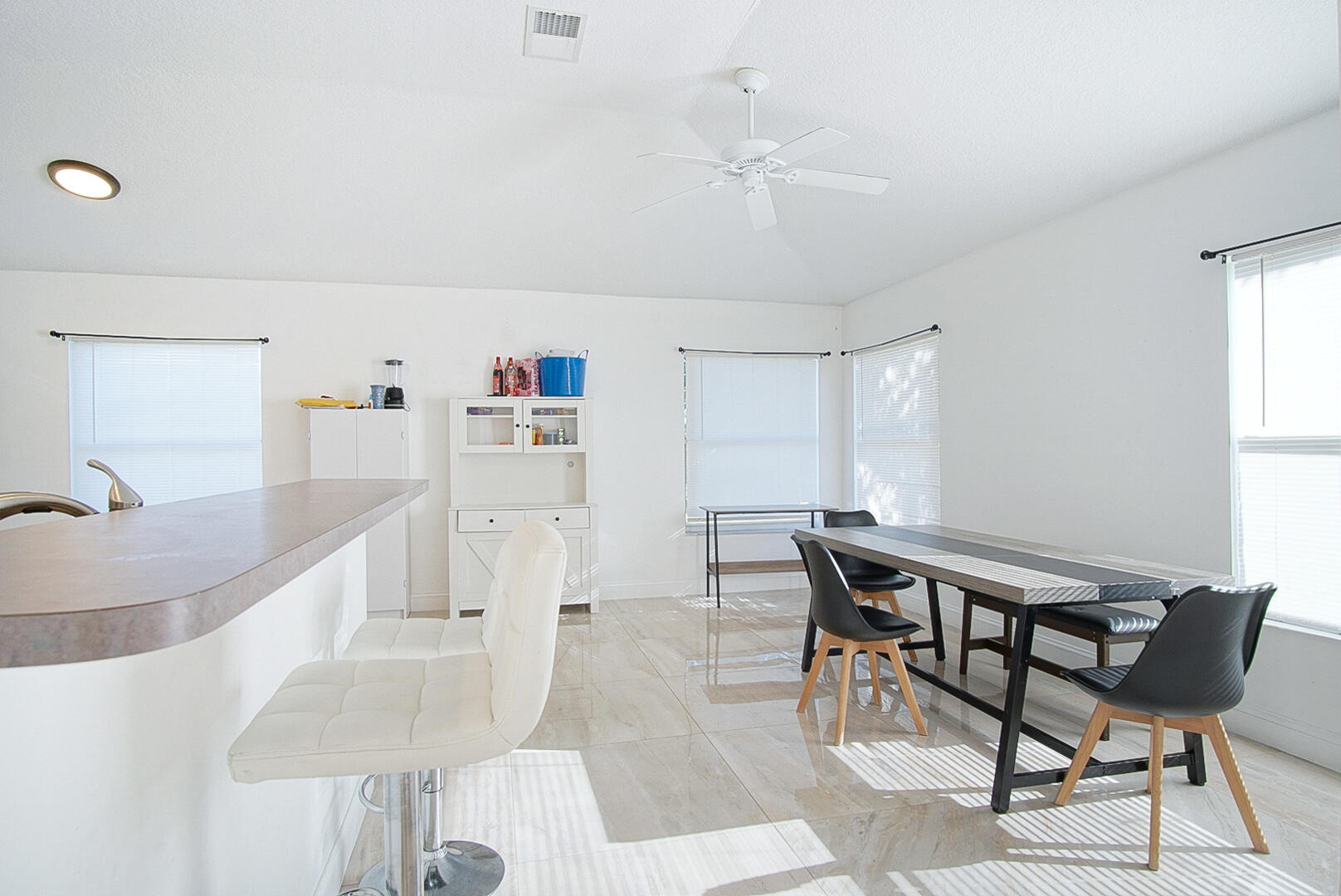 2619 Southwest Fair Isle Road Port St. Lucie, FL 34987 - Photo 6 of 33 a view of a dining room with furniture and a chandelier