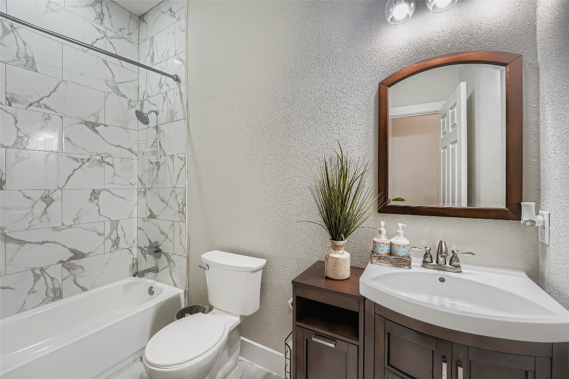 149 Arosa Drive Elgin, TX 78621 - Photo 10 of 40 a bathroom with a sink toilet and shower