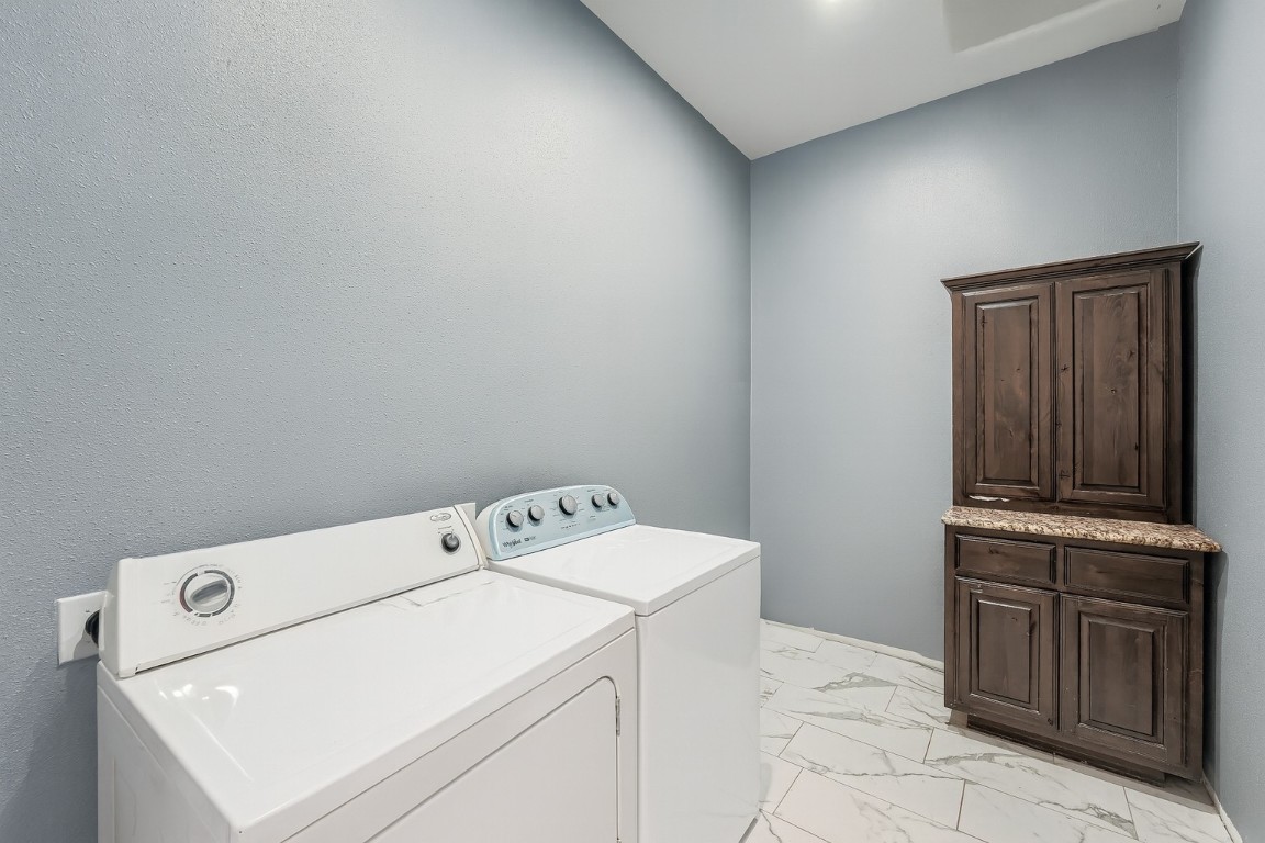 149 Arosa Drive Elgin, TX 78621 - Photo 18 of 40 a utility room with dryer and washer