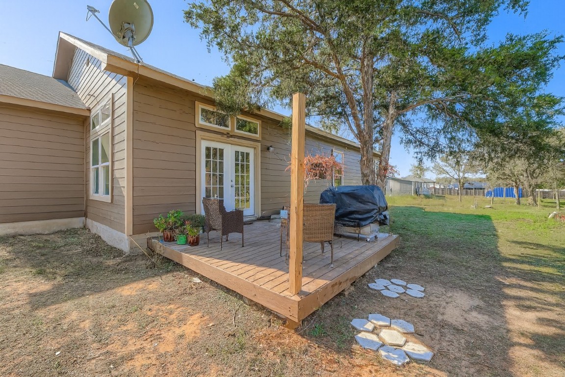 149 Arosa Drive Elgin, TX 78621 - Photo 19 of 40 a view of a house with backyard and a tree