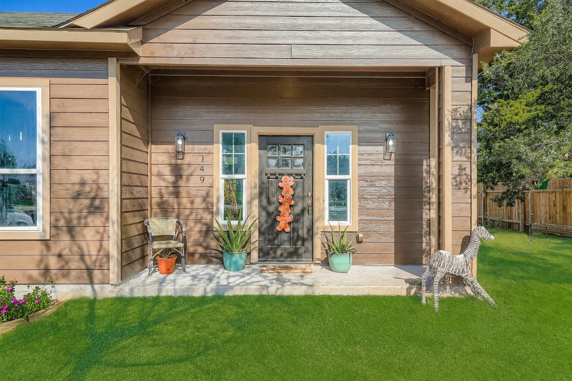 149 Arosa Drive Elgin, TX 78621 - Photo 2 of 40 a front view of a house with a yard and table and chairs