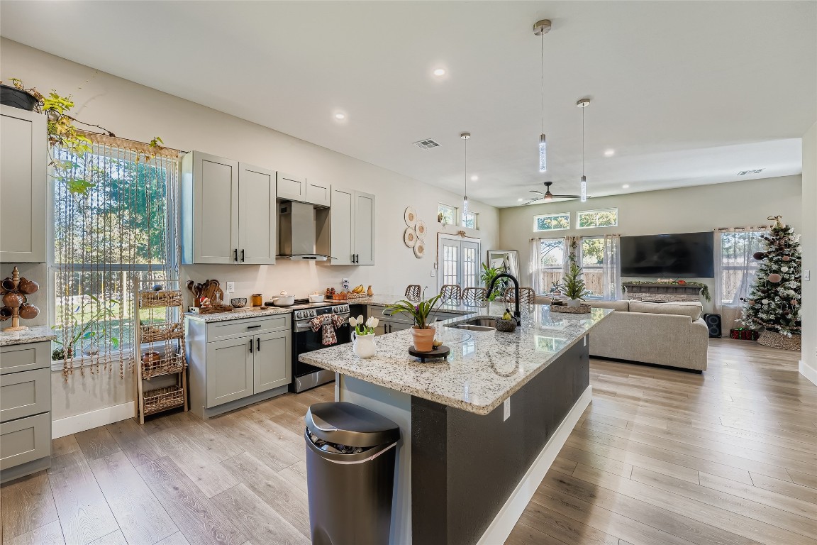 149 Arosa Drive Elgin, TX 78621 - Photo 26 of 40 a kitchen with sink stove and microwave