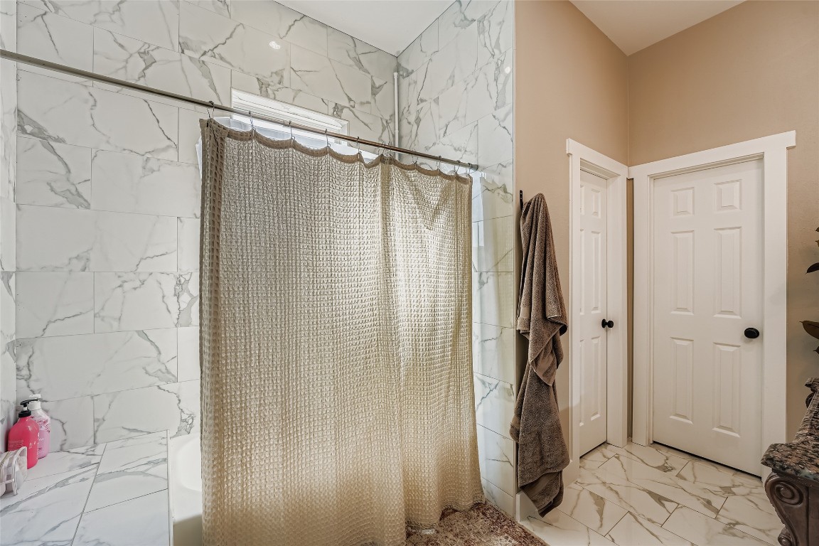 149 Arosa Drive Elgin, TX 78621 - Photo 29 of 40 a bathroom with a shower and a sink