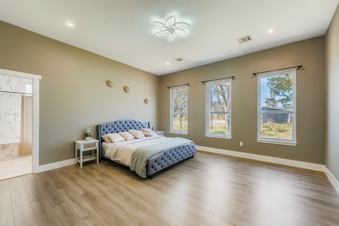 149 Arosa Drive Elgin, TX 78621 - Photo 5 of 40 a bedroom with a bed and a window