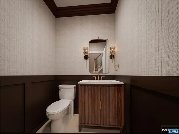 a bathroom with a toilet a sink and mirror