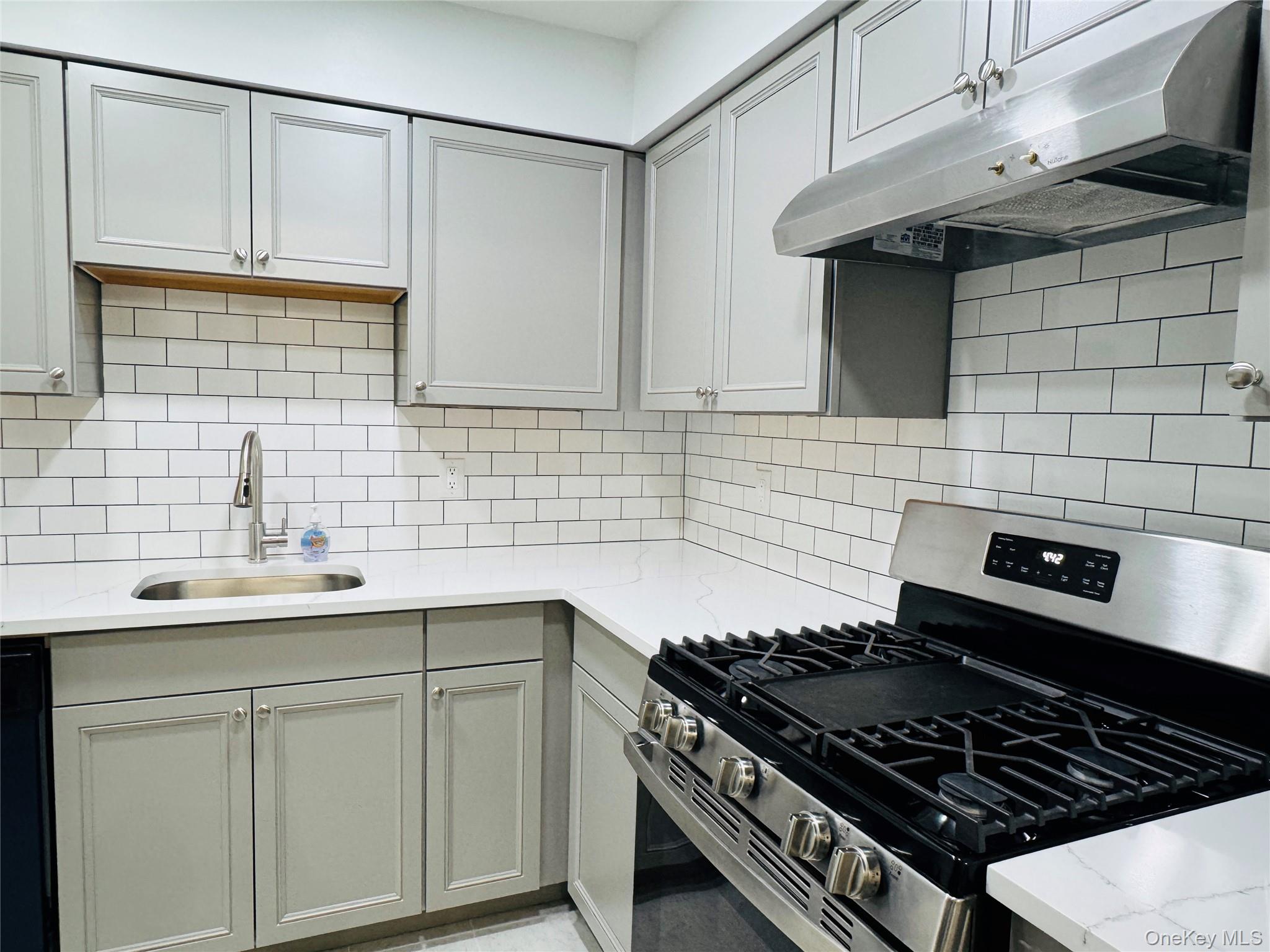 1 Ruth Court Middletown, NY 10940 - Photo 4 of 22 a kitchen with granite countertop a sink stainless steel appliances and cabinets