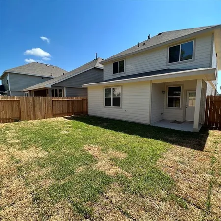 a house view with a backyard space
