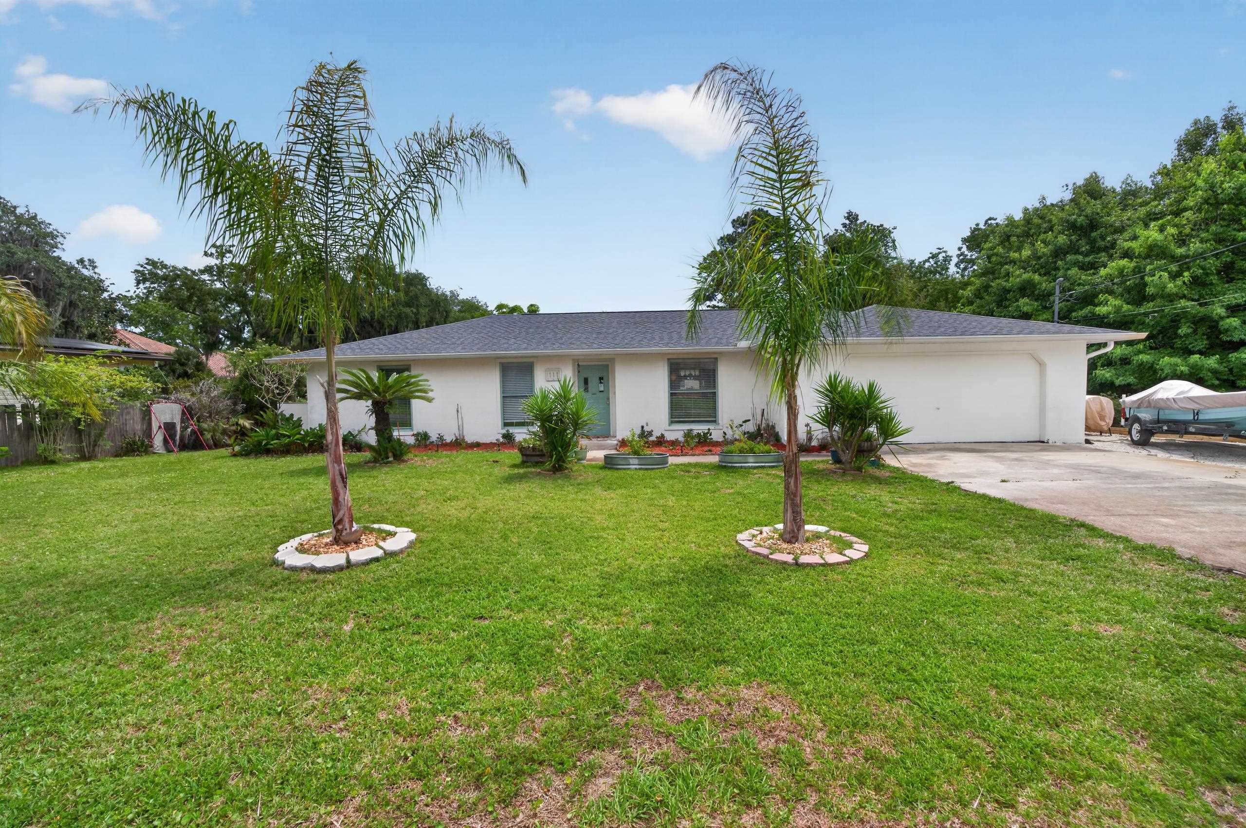111 Pompano Road St. Augustine, FL 32086 - Photo 1 of 61 a front view of a house with a yard