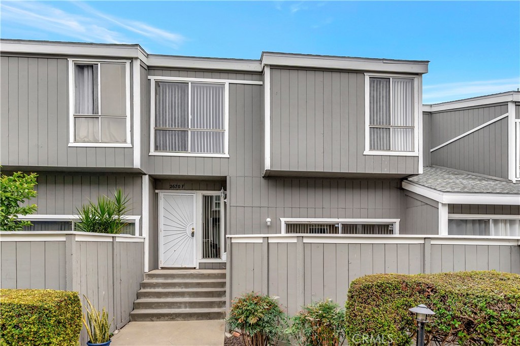 a front view of a house with a garage
