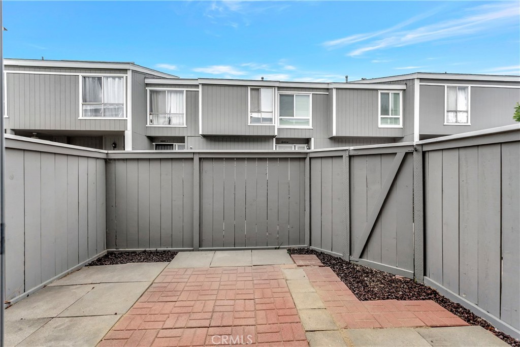 2670 West Segerstrom Avenue, Unit F Santa Ana, CA 92704 - Photo 17 of 28 a view of backyard with windows