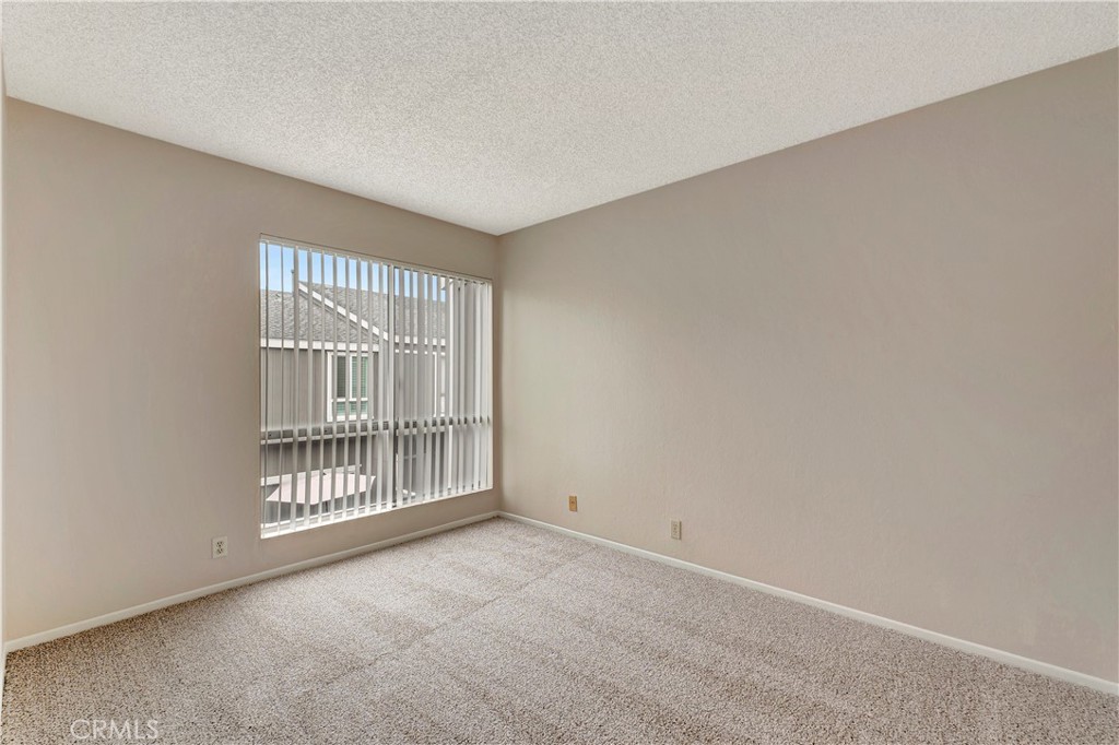 2670 West Segerstrom Avenue, Unit F Santa Ana, CA 92704 - Photo 20 of 28 an empty room with windows