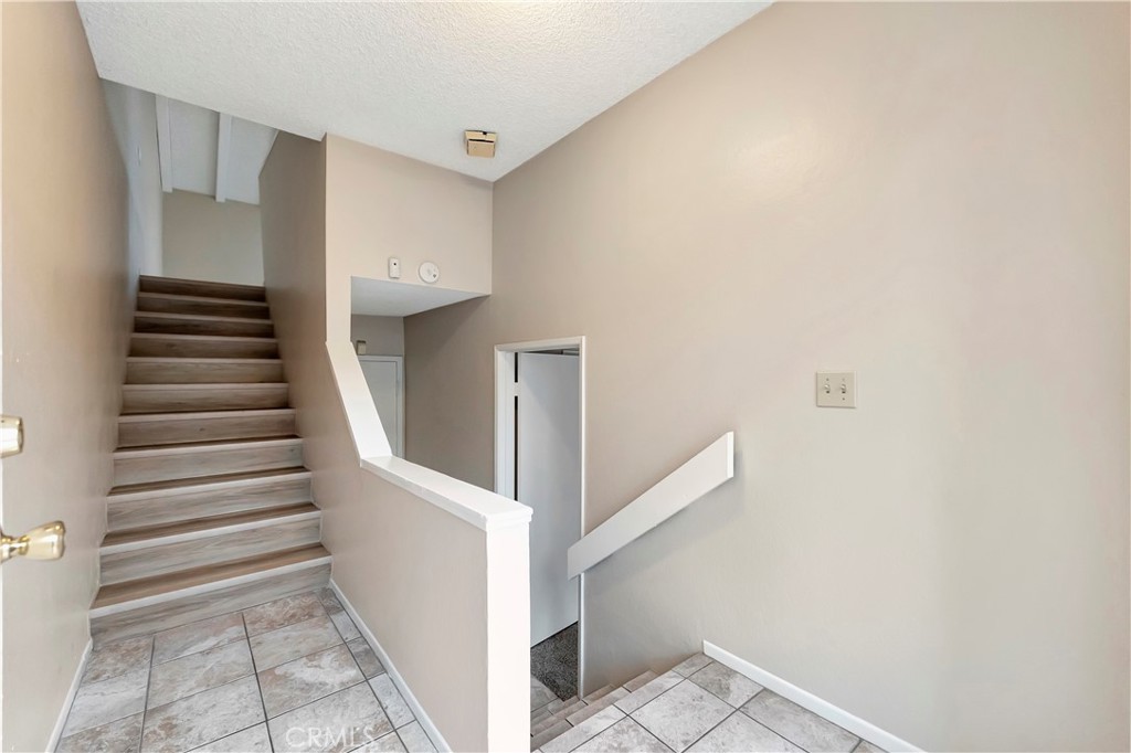 2670 West Segerstrom Avenue, Unit F Santa Ana, CA 92704 - Photo 2 of 28 a view of entryway with stairs
