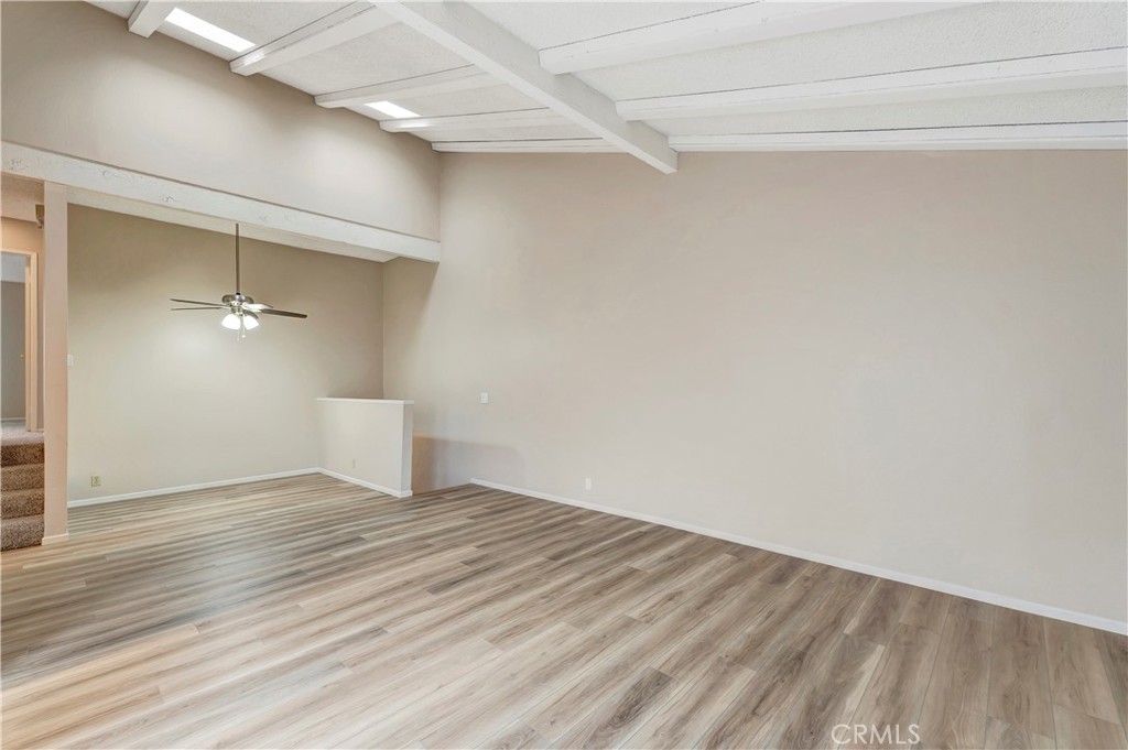 2670 West Segerstrom Avenue, Unit F Santa Ana, CA 92704 - Photo 5 of 28 a view of an empty room with wooden floor