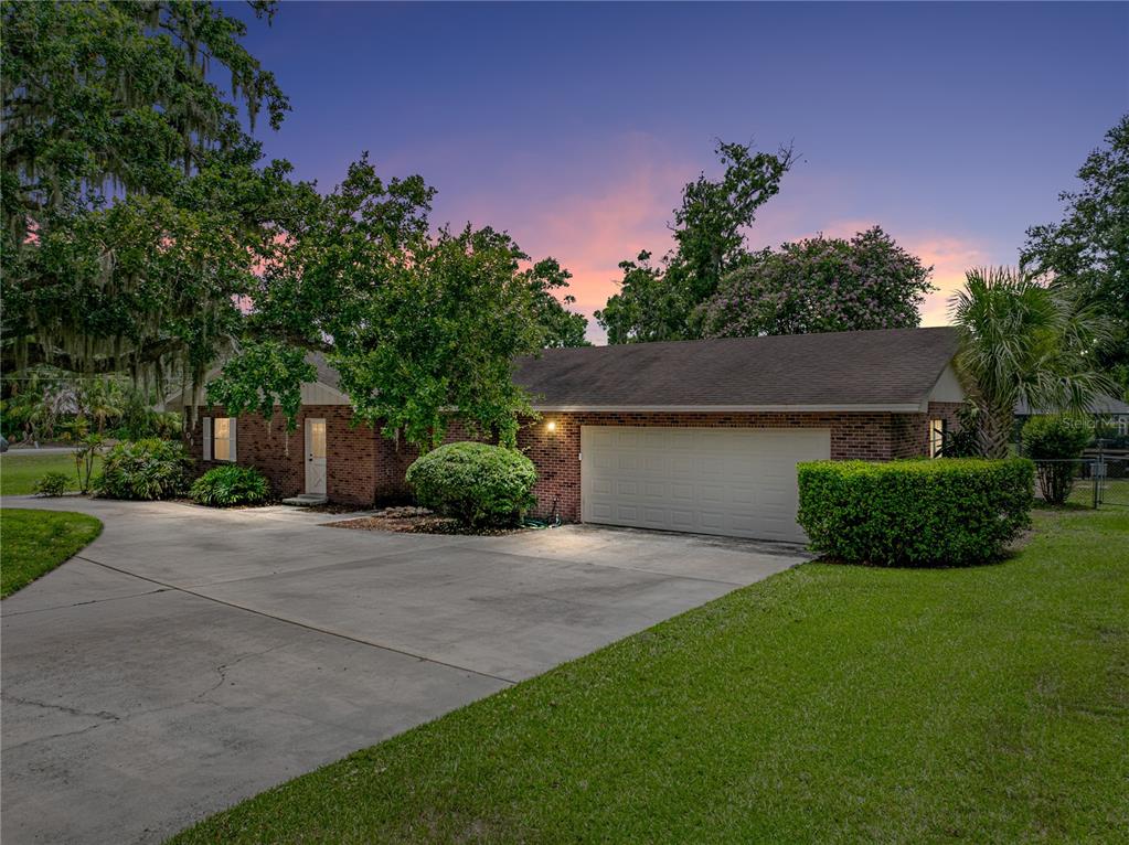 609 West Pipkin Road Lakeland, FL 33813 - Photo 1 of 72 a front view of a house with a yard and garage
