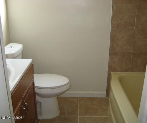 670 Denslowe Drive Reno, NV 89512 - Photo 8 of 12 a white toilet sitting next to a shower