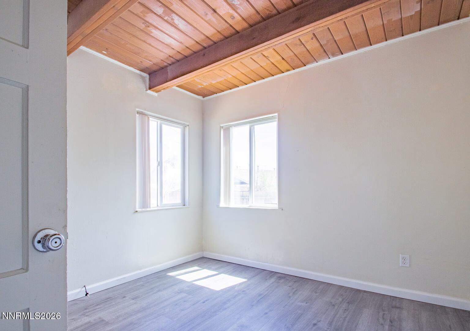 670 Denslowe Drive Reno, NV 89512 - Photo 9 of 12 a view of an empty room with wooden floor and a window