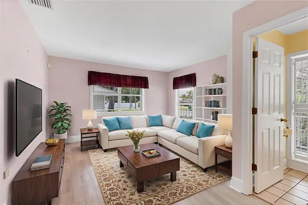 a living room with furniture and a flat screen tv