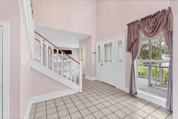 a view of an entryway with wooden floor