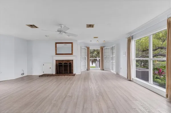 a view of kitchen with furniture and wooden floor