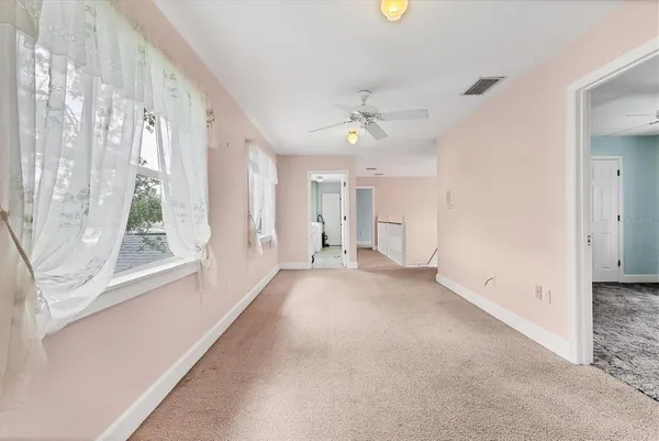 a view of an empty room with a bathroom