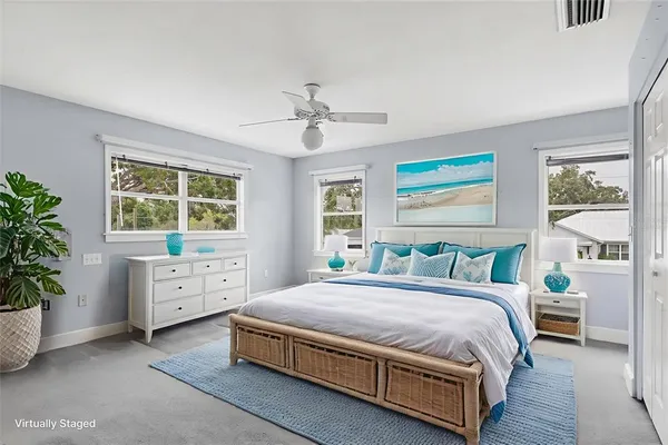 a bathroom with a granite countertop sink mirror and a bathtub