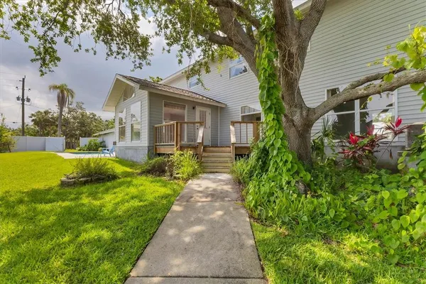 a front view of a house with garden