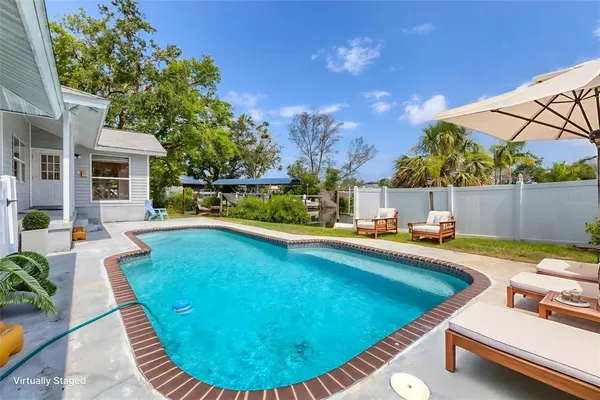 a view of a swimming pool with a patio