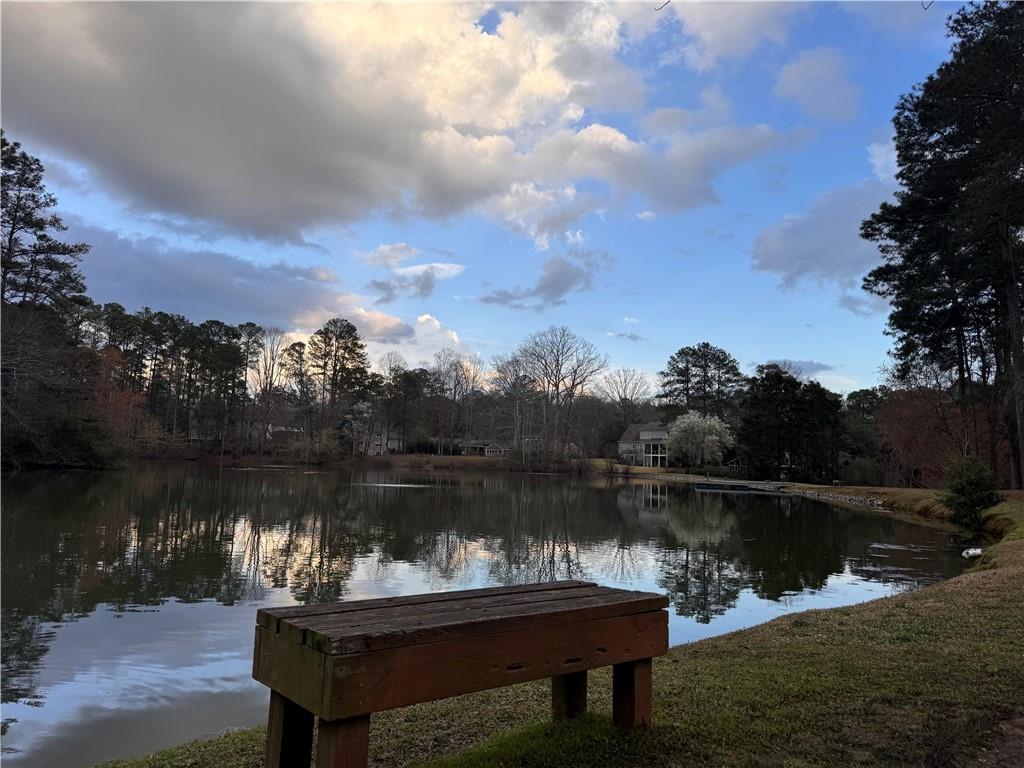 192 Kings Row Northeast Marietta, GA 30067 - Photo 31 of 34 a lake view with a table under an umbrella