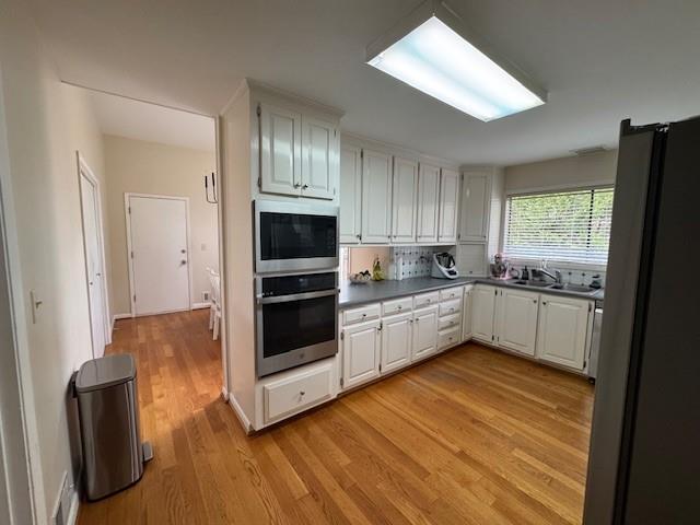 192 Kings Row Northeast Marietta, GA 30067 - Photo 6 of 34 a kitchen with stainless steel appliances a refrigerator sink and cabinets