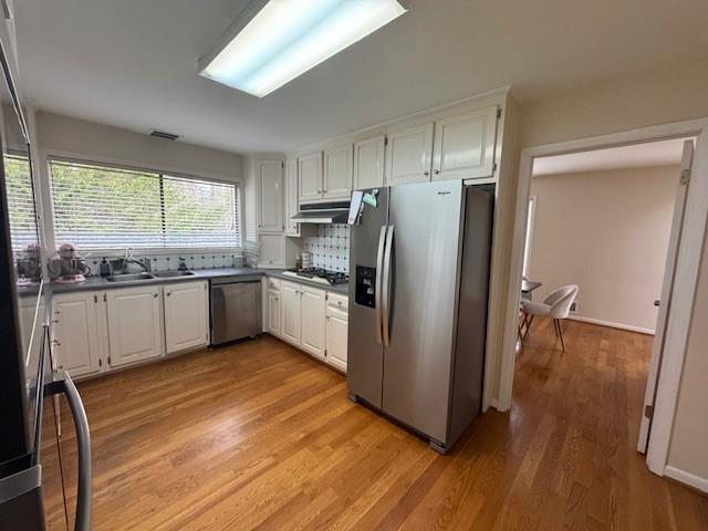 192 Kings Row Northeast Marietta, GA 30067 - Photo 7 of 34 a kitchen with stainless steel appliances a refrigerator sink and cabinets