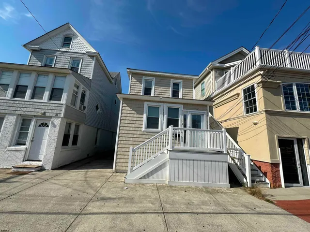 a front view of a house with a garage