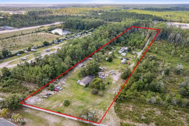a view of a garden with an outdoor seating