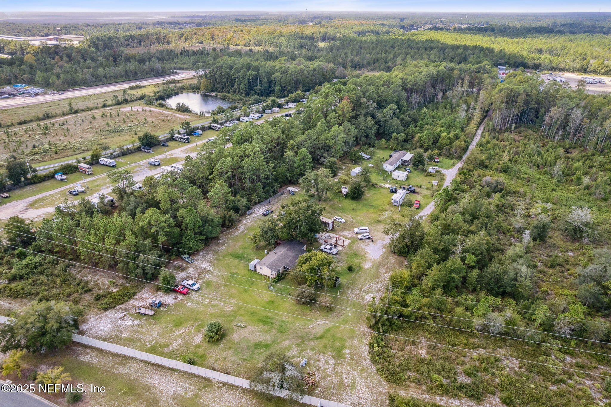86158 Overstreet Lane Yulee, FL 32097 - Photo 11 of 25 a view of a garden with a tree