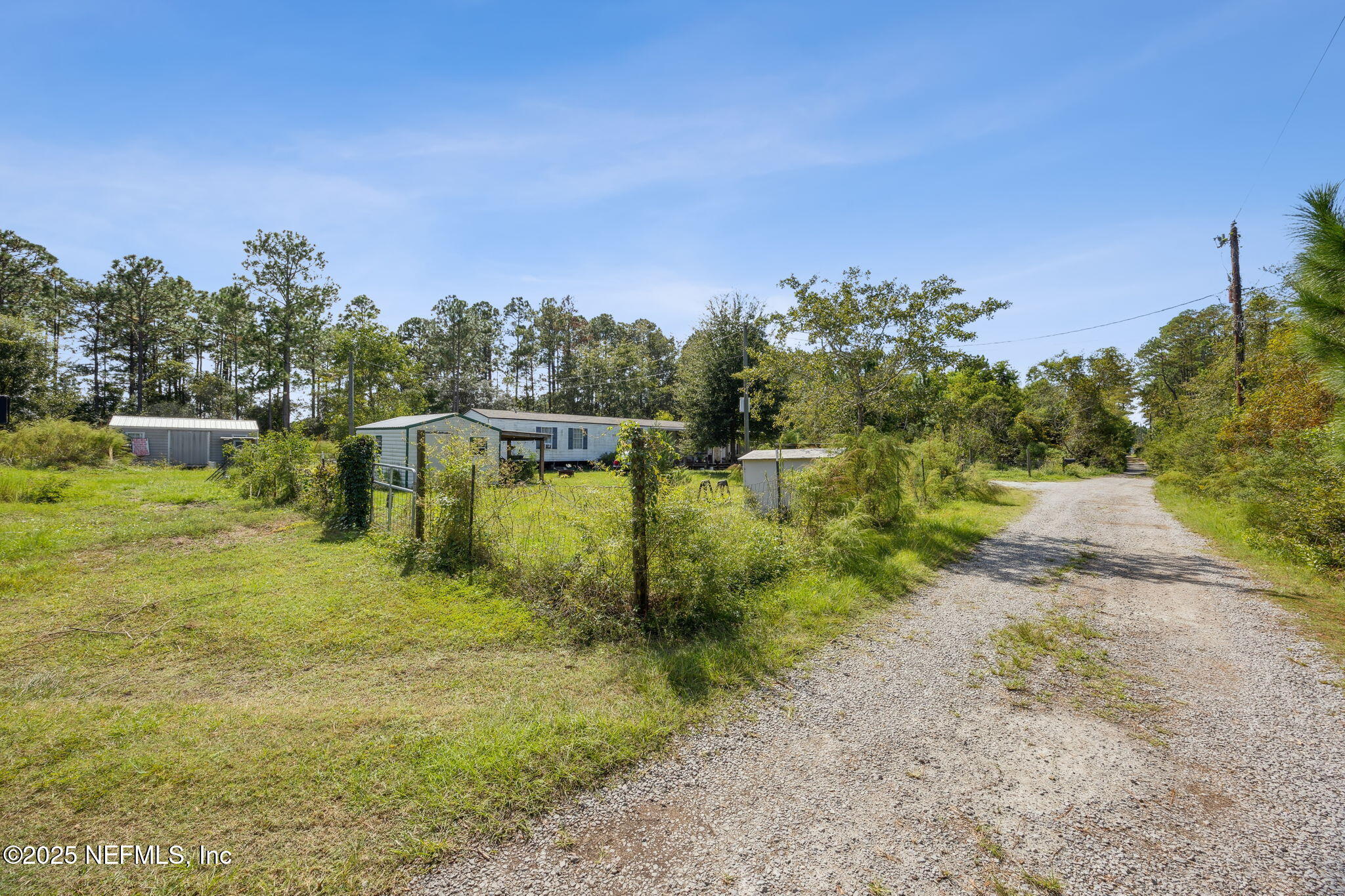 86158 Overstreet Lane Yulee, FL 32097 - Photo 23 of 25 a view of a lake with houses