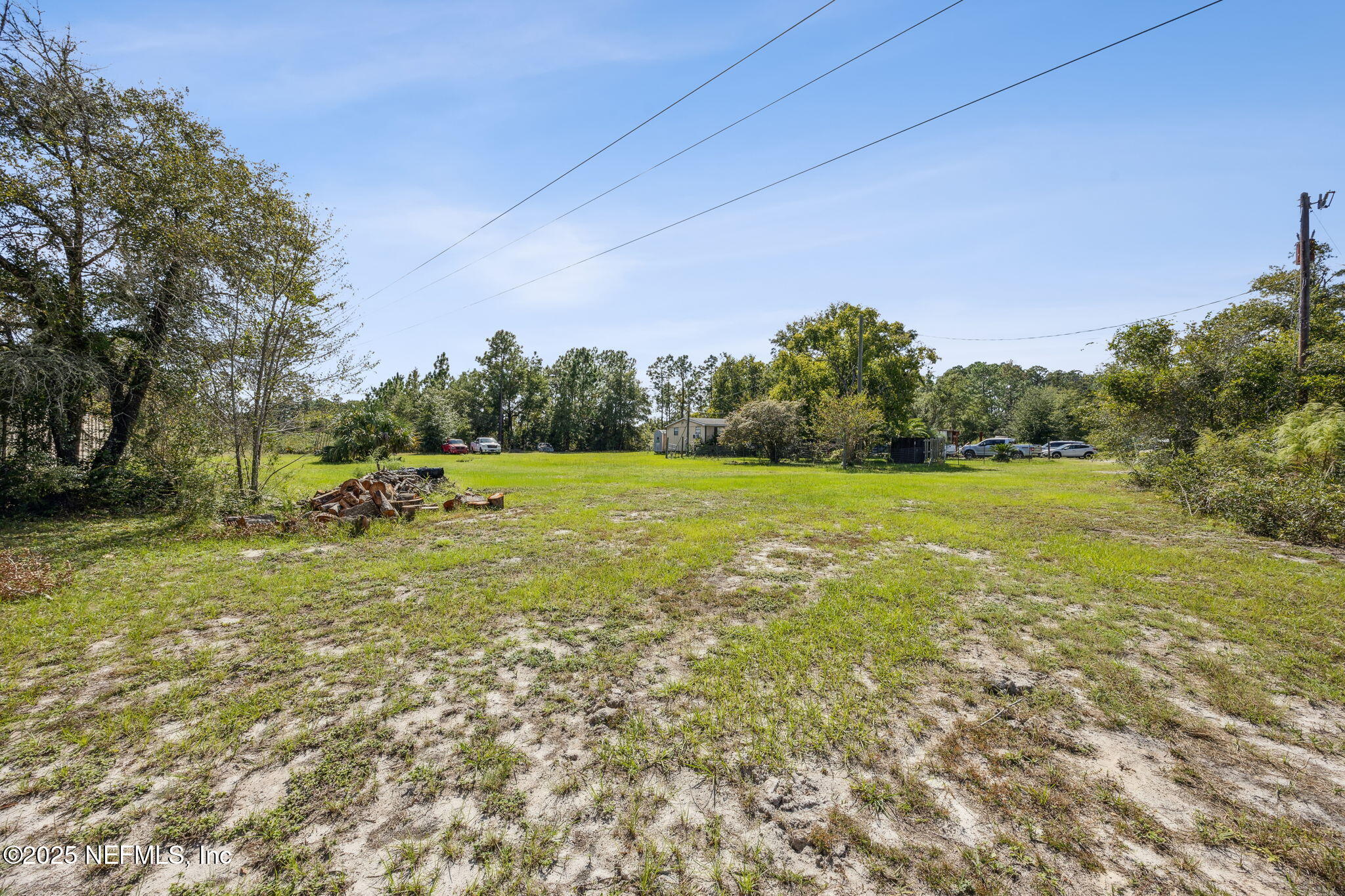 86158 Overstreet Lane Yulee, FL 32097 - Photo 3 of 25 a view of a field with trees in the background