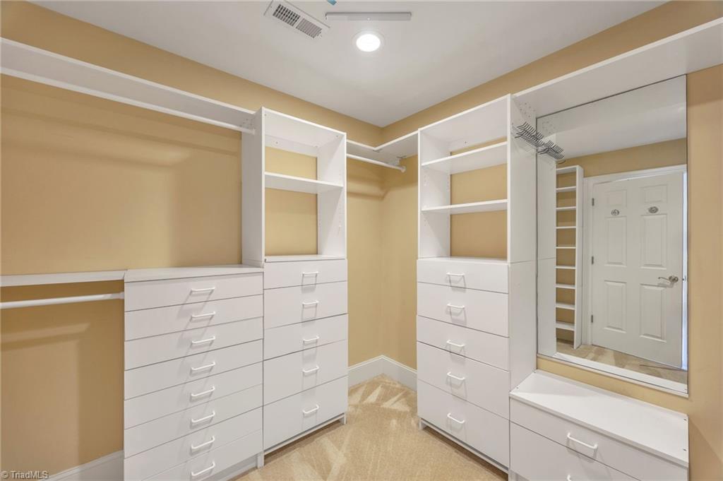 6694 Fegan Road Summerfield, NC 27358 - Photo 20 of 35 Primary Bedroom Closet with Built In Shelves