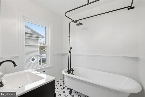 a bathroom with a sink a bathtub and a shower