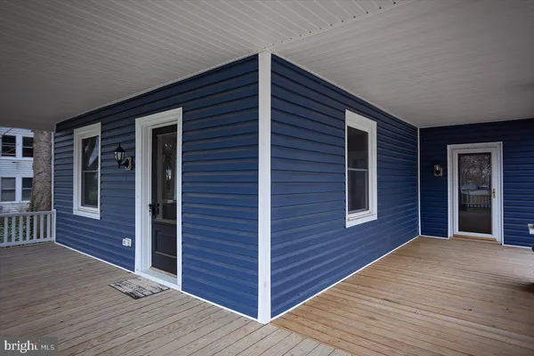 a view of a house with wooden deck