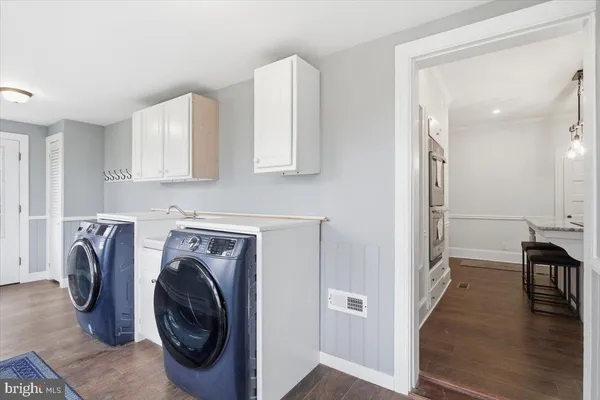 a view of a kitchen with washer and dryer