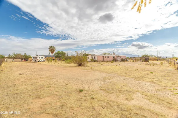 a view of a swimming pool with an outdoor seating