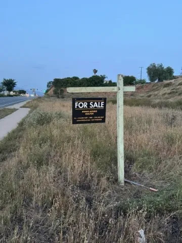 a sign board with ocean view
