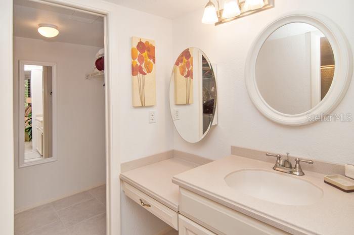 6415 Midnight Pass Road, Unit 210 Sarasota, FL 34242 - Photo 13 of 25 Master bathroom vanity and closet