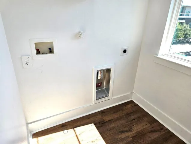 a view of an entryway with wooden floor