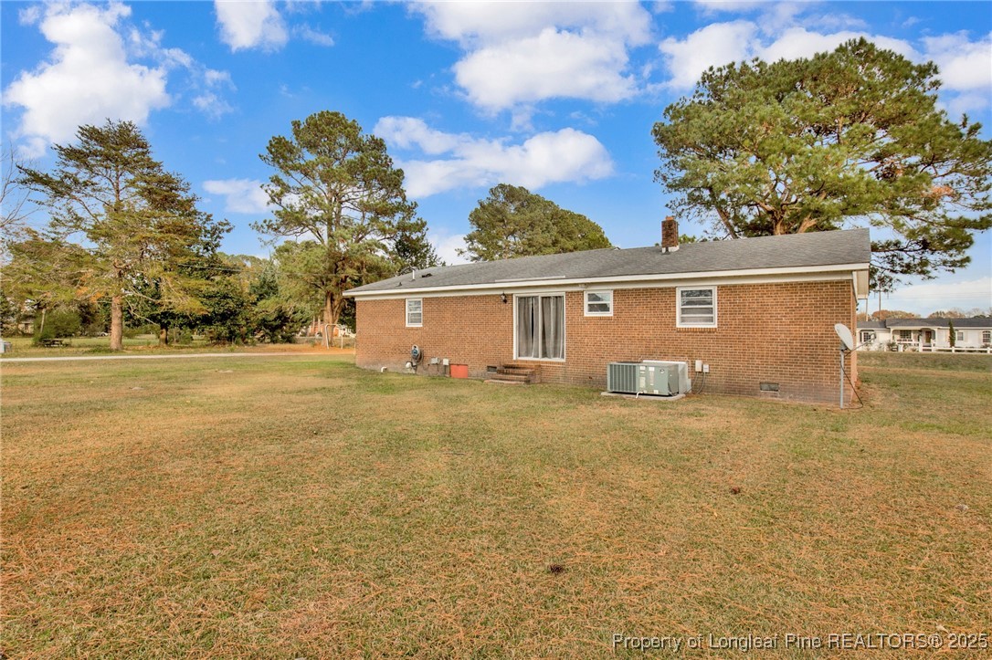 623 Isaac Weeks Road Clinton, NC 28328 - Photo 24 of 24 a view of a house with a backyard