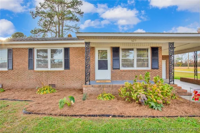 front view of a house with a yard
